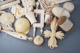 A mixed collection of antique ivory to include a late 18th / early 19th century Chinese carved cartouche, a simulated jockey cap tape measure, etc